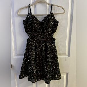 A dress from privy, black with sequence, and a small